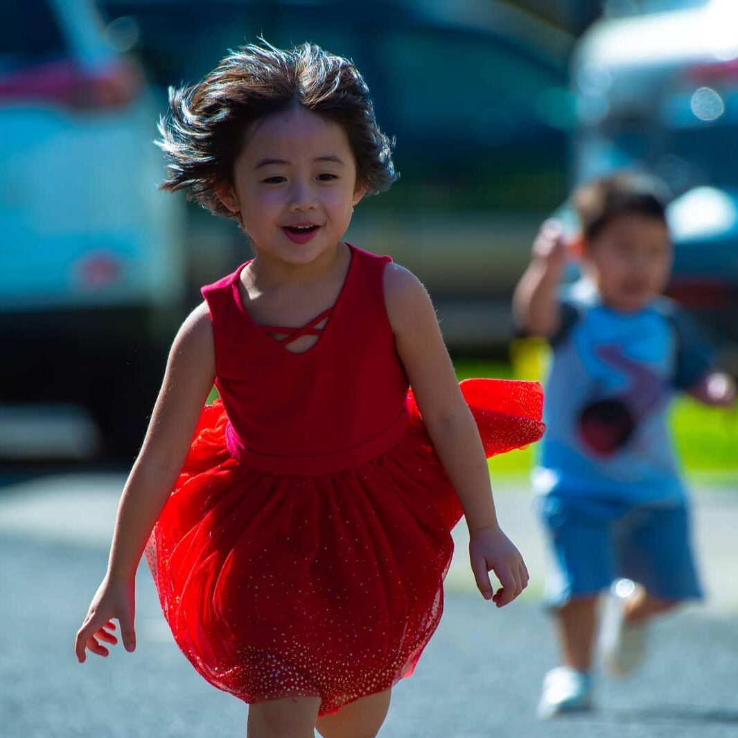 Canva - Photo of Girl in Red Dress Running on Street (1) (1)